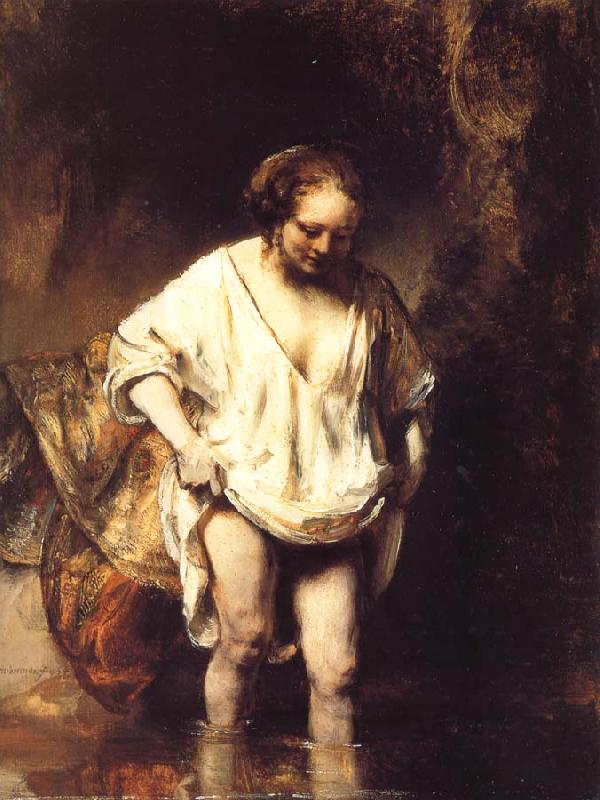 REMBRANDT Harmenszoon van Rijn A Woman Bathing in a Stream